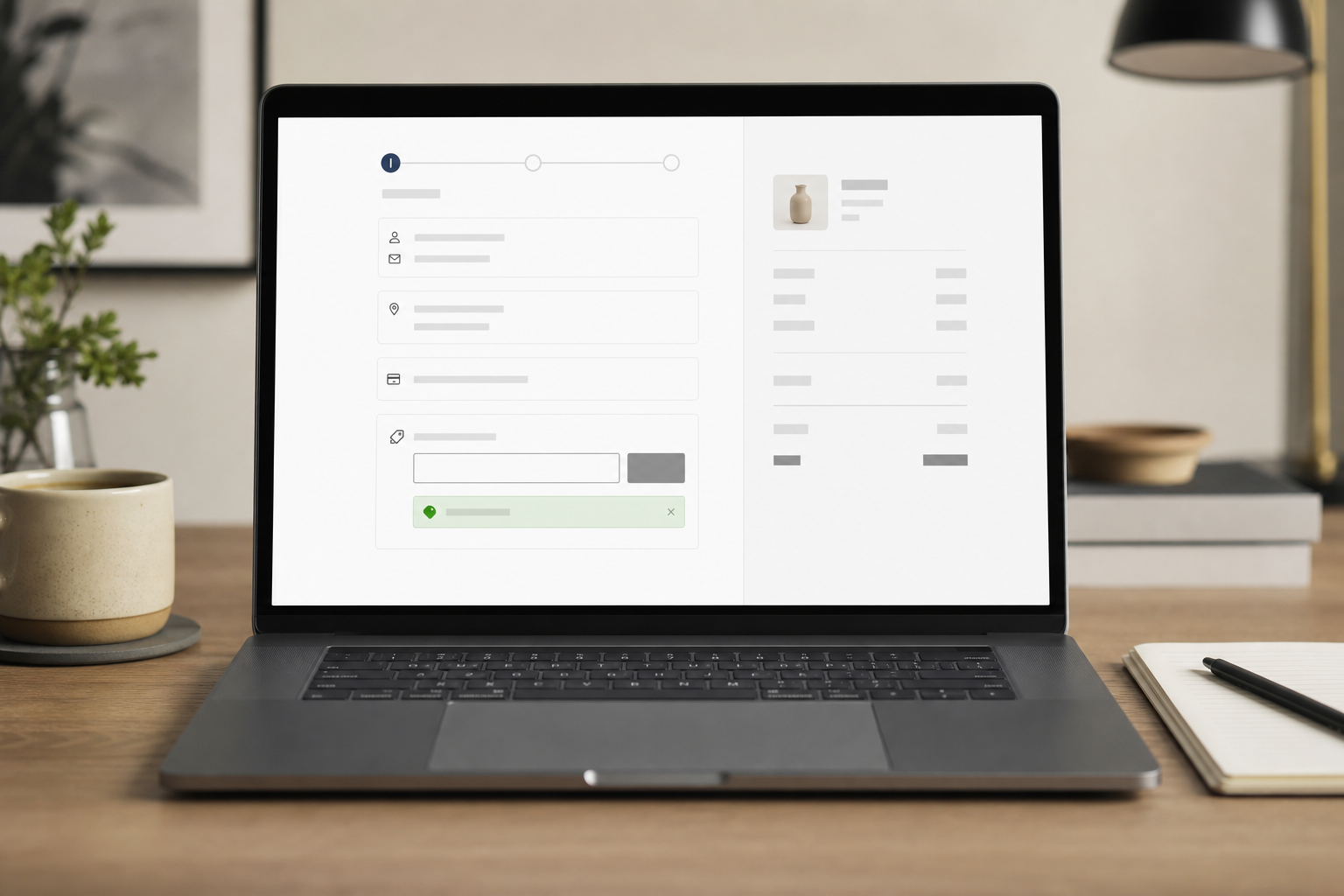 Laptop showing Shopify checkout with discount code applied